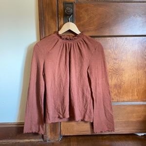 Rust mock neck shirt with bell sleeves